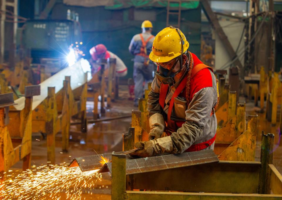 Chinese shipyard workers working on various elements of shipping equipment in Nantong, China, on July 8, 2024.