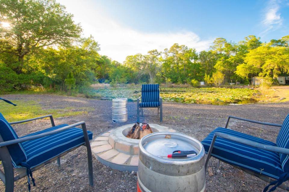 Outside, guests can enjoy a fire pit with keg end tables or cook on the grill -- a good thing, since there is no kitchen, oven or even a stovetop in the man cave. Photo credit: Airbnb.