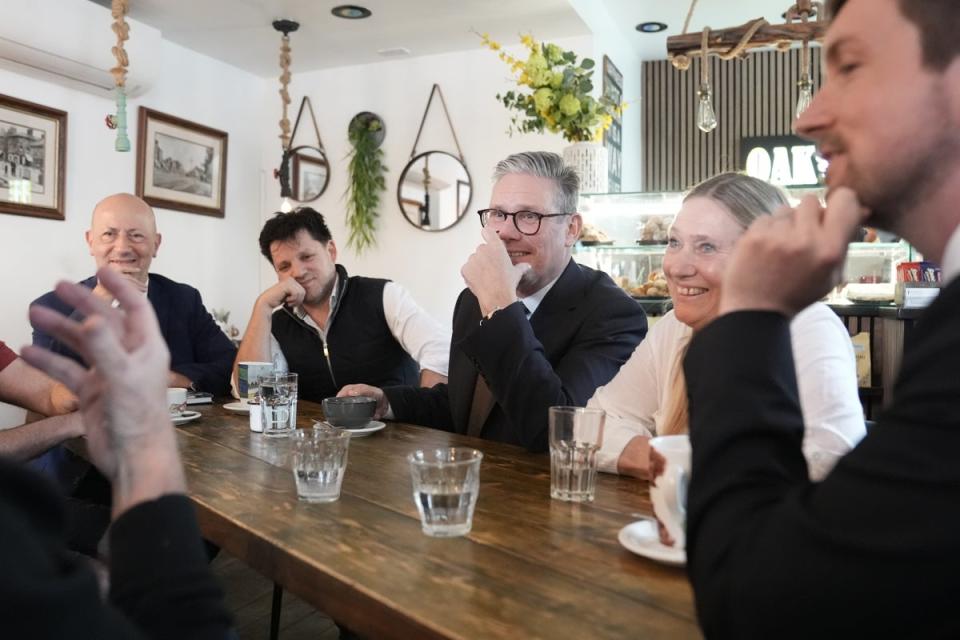 Sir Keir Starmer meets local business owners during a visit to the Oak  Caffe in Barnet on Monday (Stefan Rousseau/PA Wire)