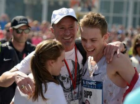 Feb 13, 2016; Los Angeles, CA, USA; Galen Rupp (right) celebrates with wife Keara Rupp (left) and coach Alberto Salazar after winning in 2:11:12 during the 2016 U.S. Olympic Trials marathon. Mandatory Credit: Kirby Lee-USA TODAY Sports