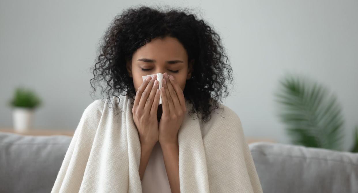 Woman with cold virus. (Getty Images)