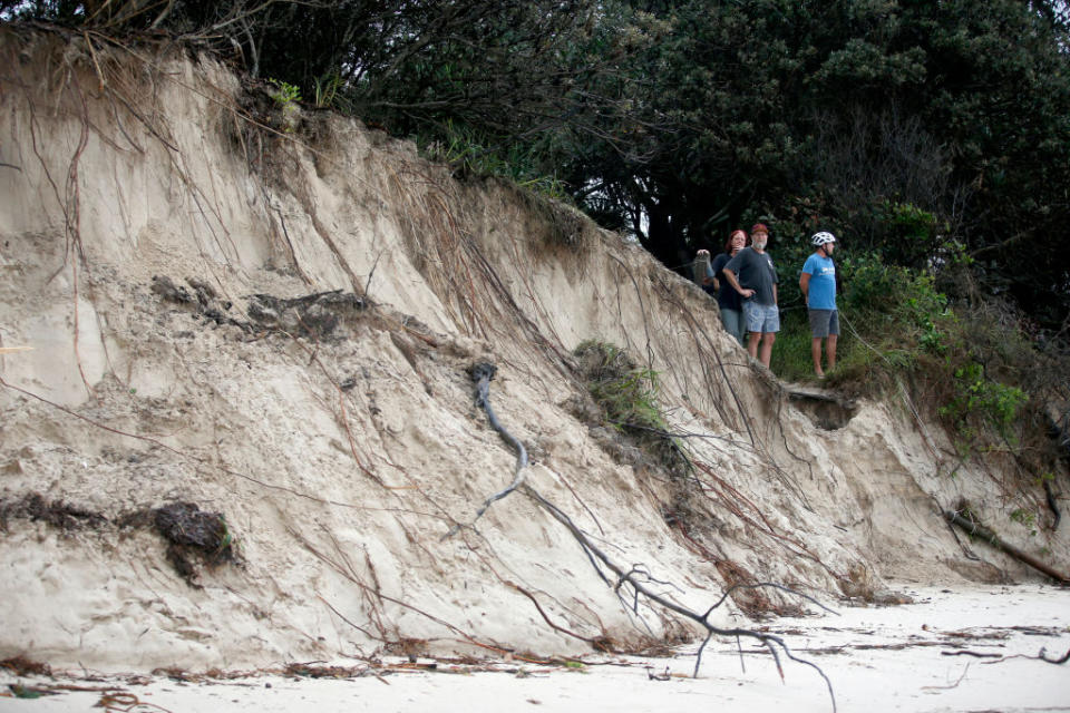 Local residents check the damage along the stretch of beaches due to erosion in Byron Bay. 
