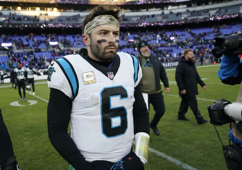 FILE - Carolina Panthers quarterback Baker Mayfield (6) walks off the field after his teams loss to the Baltimore Ravens