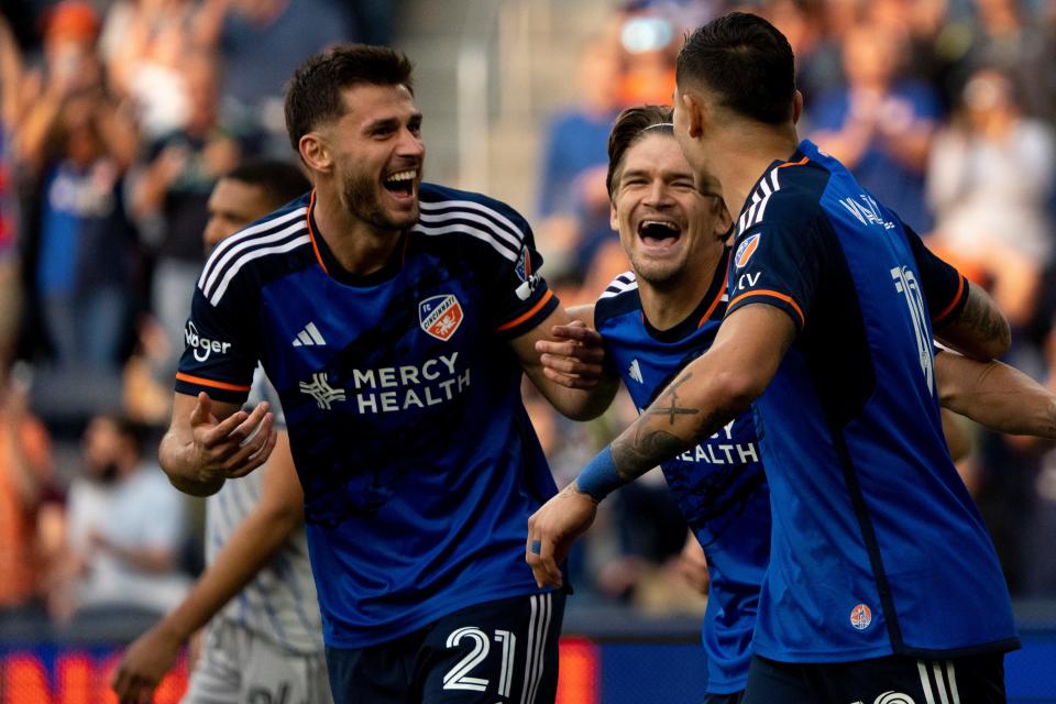 FC Cincinnati defender Matt Miazga (21), FC Cincinnati defender Nick Hagglund (4) and FC Cincinnati forward Brandon Vázquez (19) celebrate after an own goal in the first half of the MLS match between the FC Cincinnati and the CF Montréal on Wednesday, May 17, 2023 in Cincinnati. 