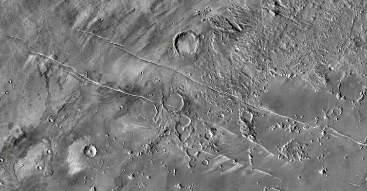 <span class="caption">600 km wide region of Mars, with the fractures known as Cerberos Fossae running diagonally from westnorthwest to eastsoutheast.</span> <span class="attribution"><span class="source">ESA/DLR/FU Berline (G Neukum)</span></span>