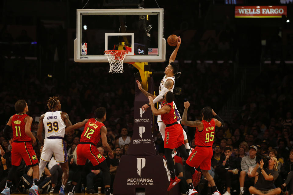 LOS ANGELES, CALIFORNIA - NOVEMBER 17:  Danny Green #14 of the Los Angeles Lakers dunks the ball as Allen Crabbe #33 of the Atlanta Hawks defends during the first half of a game at Staples Center on November 17, 2019 in Los Angeles, California. NOTE TO USER: User expressly acknowledges and agrees that, by downloading and or using this photograph, User is consenting to the terms and conditions of the Getty Images License Agreement.  (Photo by Katharine Lotze/Getty Images)