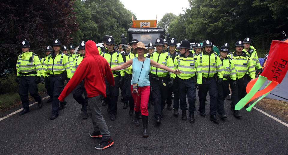 Protesters attempt to slow vehicles down that are arriving at the Balcombe fracking site in West Sussex as energy company Cuadrilla has started testing equipment ahead of exploratory oil drilling in the English countryside as anti-fracking protests at the site entered a ninth day.