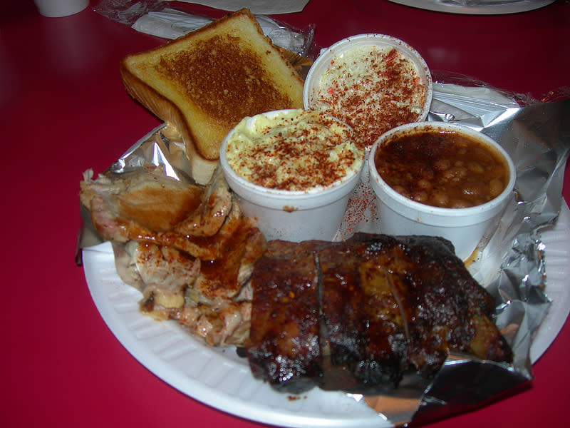 <b>Mississippi: Rib Platter</b> This huge platter from The Rib Cage is served with beans, slaw, hickory smoked potato and bread.<br> <br> (Image courtesy <a href="http://www.flickr.com/photos/auvet/6961701708/" rel="nofollow noopener" target="_blank" data-ylk="slk:Jimmywayne/Flickr;elm:context_link;itc:0;sec:content-canvas" class="link ">Jimmywayne/Flickr</a>)