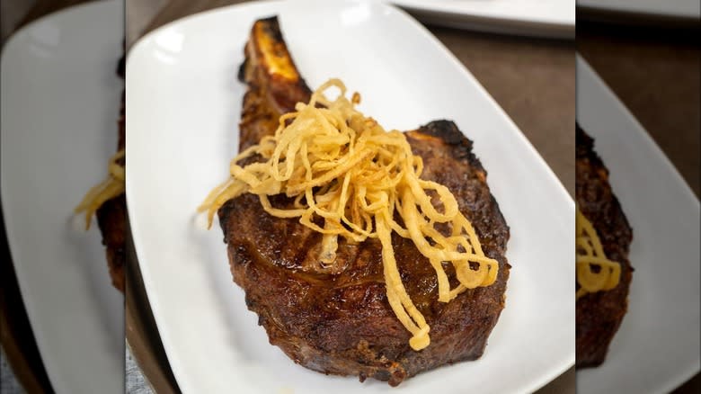 Delmonico's steak, fried onion strings