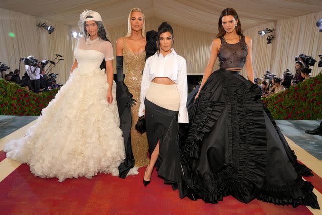 <p>Kevin Mazur/MG22/Getty</p> Kylie Jenner, Khloe Kardashian, Kourtney Kardashian, and Kendall Jenner arrive at The 2022 Met Gala.
