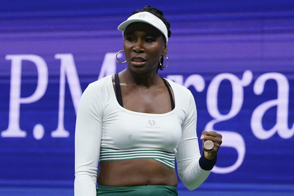 FILE - Venus Williams, of the United States, reacts during her first-round doubles match with Serena Williams, against Lucie Hradecka and Linda Noskova, of the Czech Republic, at the U.S. Open tennis championships on Sept. 1, 2022, in New York. Williams has been awarded a wild-card entry to play at the Australian Open in January 2023, 25 years after she played the Grand Slam tournament for the first time. (AP Photo/Frank Franklin II, File)