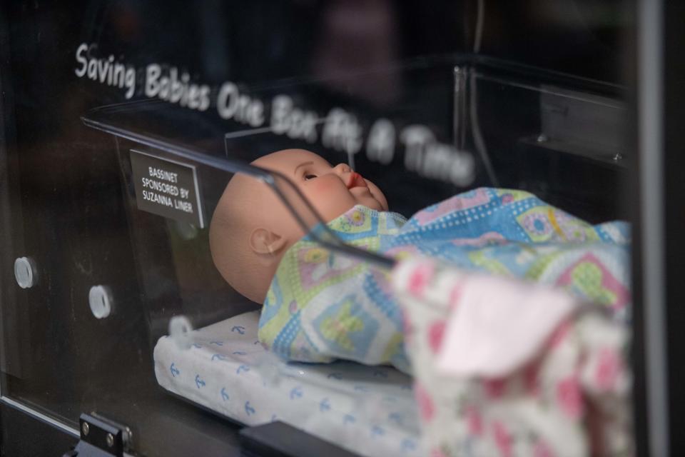 A baby doll sits safely inside the dropoff box inside Jackson Fire Department Station 2 during the unveiling of the Safe Haven Baby Box in Jackson, Tenn. on Sept. 13, 2023.