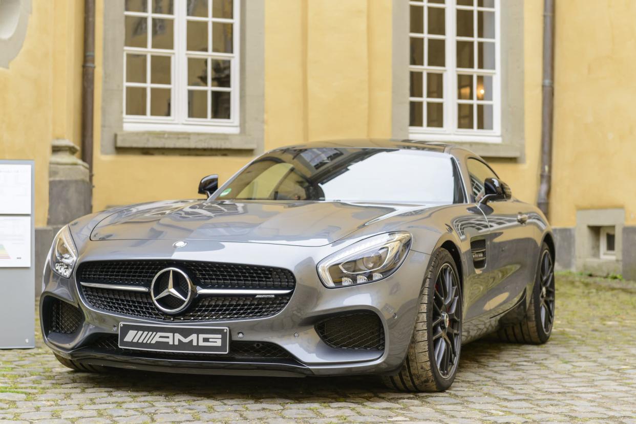J&#xfc;chen, Germany - August 5, 2016: Gray Mercedes-AMG GT coupe performance  sports car front view. The Mercedes AMG GT is powered by a front-mid mounted 4-litre twin-turbo V8. The car is on display during the 2016 Classic Days at castle Dyck.