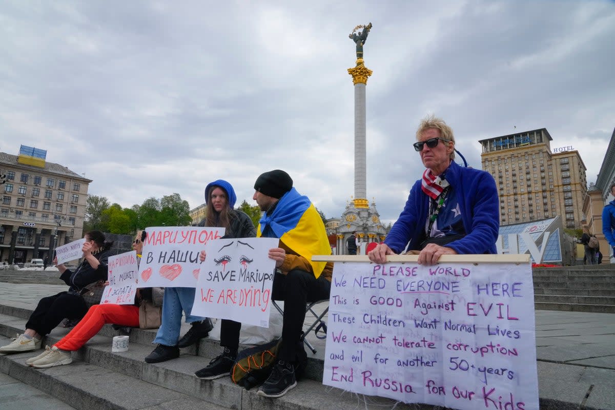 Ryan Wesley Routh, right, takes part in a rally in central Kyiv, Ukraine on April 30, 2022 (AP)