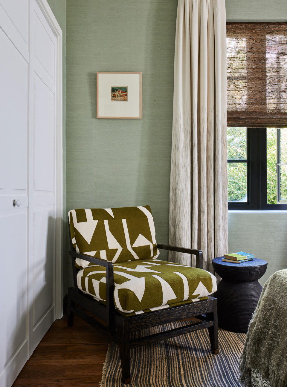 Pale green bedroom with brown accents