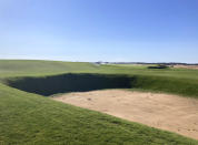 This Sept. 27, 2021 photo shows The Lido Golf Club under construction at Sand Valley Golf Resort in Nekoosa, Wis. The course was designed through old photos and documents, with the help of a course-building video game. The Lido will be an exact restoration of an abandoned course of the same name on Long Island, long considered one of the best golf courses in the world. (AP Photo/John Marshall)