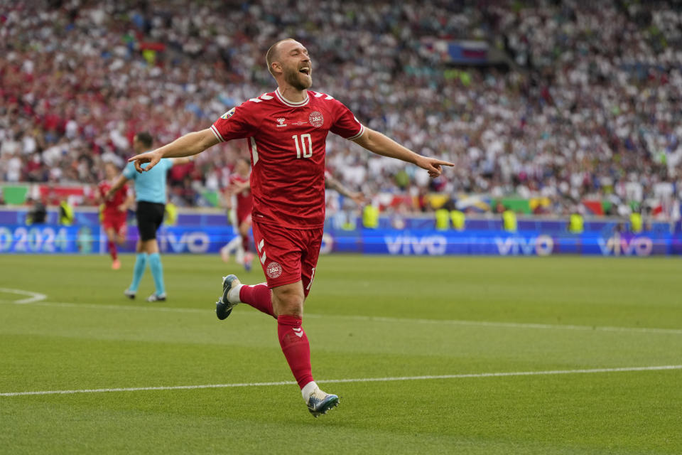 Denmark's Christian Eriksen celebrates after scoring the opening goal of the game during a Group C match between Slovenia and Denmark at the Euro 2024 soccer tournament in Stuttgart, Germany, Sunday, June 16, 2024. (AP Photo/Matthias Schrader)