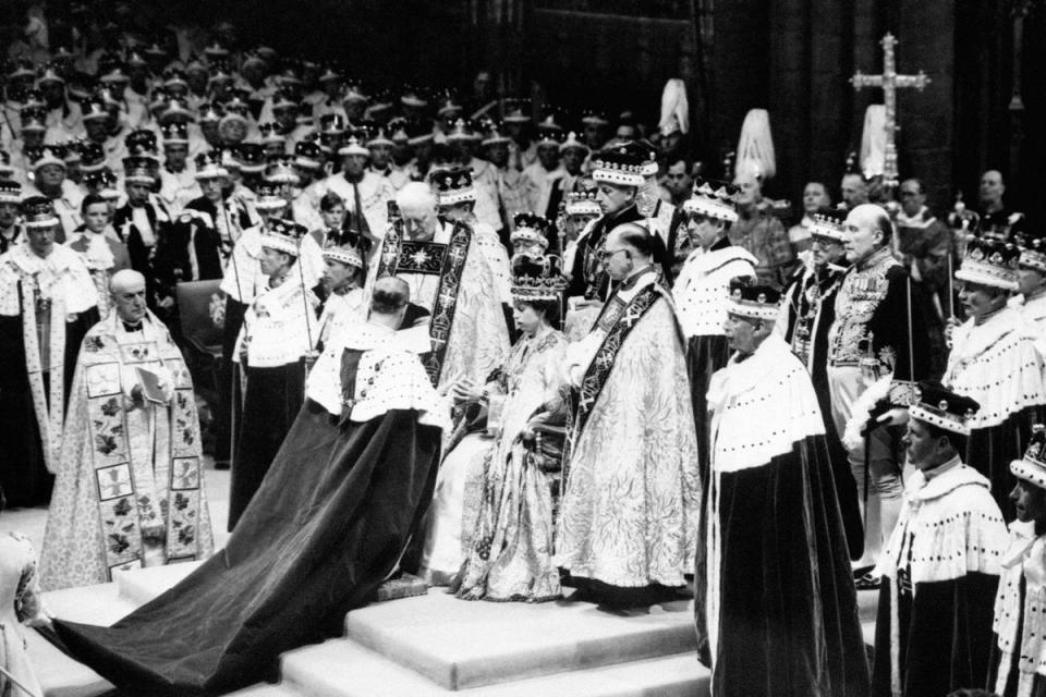 The Duke of Norfolk, the Earl Marshall, paying homage to Queen Elizabeth after her coronation at Westminster Abbey in 1953 (PA Wire)