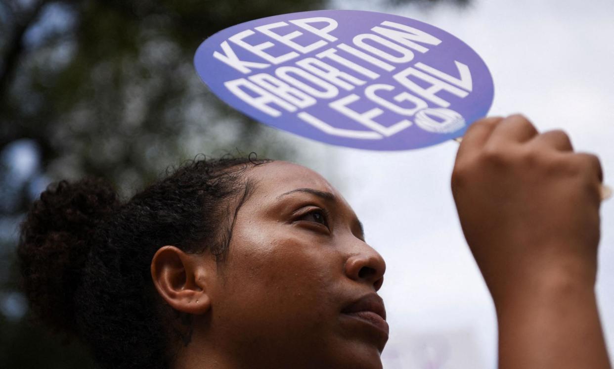 <span>An abortion rights protester in Houston.</span><span>Photograph: Callaghan O’Hare/Reuters</span>