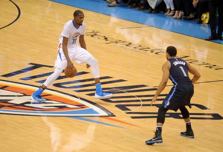 Apr 16, 2016; Oklahoma City, OK, USA; Oklahoma City Thunder forward Kevin Durant (35) dribbles the ball up the court against tDallas Mavericks guard Justin Anderson (1) during the second quarter in game one of their first round NBA Playoff series at Chesapeake Energy Arena. Mandatory Credit: Mark D. Smith-USA TODAY Sports
