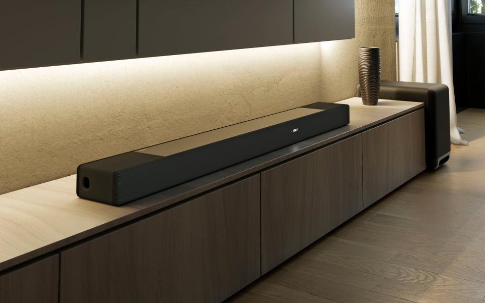 The Sony HT-A7000 soundbar atop a piece of furniture. 