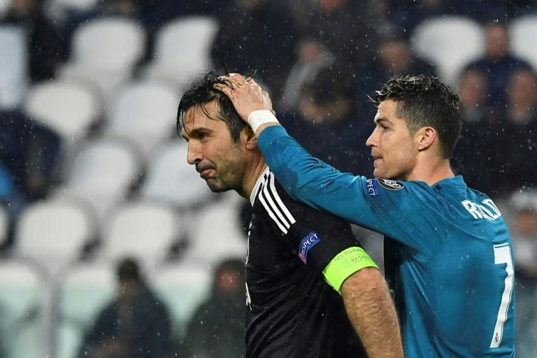 Cristiano Ronaldo comforts Juventus goalkeeper Gianluigi Buffon at the end of the match in Turin