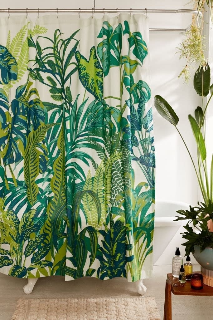 Turn your blah bathroom into a tropical paradise every time your shower gets the humidity going with this fun curtain.<br /><br /><strong>Promising review:</strong> "I bought this for my apartment, and it really makes my bathroom pop. I enjoy the vibrant colors and the quality of the curtain itself." &mdash; Urban Outfitters Customer<br /><br /><strong>Get it from Urban Outfitters for <a href="https://go.skimresources.com?id=38395X987171&amp;xs=1&amp;xcust=HPHomeMagazine-609acebfe4b099ba752f64c2-&amp;url=https%3A%2F%2Fwww.urbanoutfitters.com%2Fshop%2Fdreamy-jungle-shower-curtain" target="_blank" rel="nofollow noopener noreferrer" data-skimlinks-tracking="5854435" data-vars-affiliate="Rakuten" data-vars-campaign="SHOPMagazineHomeMower2-2-2021--5854435-" data-vars-href="https://click.linksynergy.com/deeplink?id=yPKHhJU2qBg&amp;mid=43176&amp;murl=https%3A%2F%2Fwww.urbanoutfitters.com%2Fshop%2Fdreamy-jungle-shower-curtain%3Fcolor%3D030%26type%3DREGULAR%26size%3D72X72%26quantity%3D1&amp;u1=SHOPMagazineHomeMower2-2-2021--5854435-" data-vars-keywords="cleaning" data-vars-link-id="16331335" data-vars-price="" data-vars-product-id="20945799" data-vars-product-img="https://s7d5.scene7.com/is/image/UrbanOutfitters/43398973_030_b?$xlarge$&amp;fit=constrain&amp;qlt=80&amp;wid=100" data-vars-product-title="Dreamy Jungle Shower Curtain" data-vars-redirecturl="https://www.urbanoutfitters.com/shop/dreamy-jungle-shower-curtain?color=030&amp;type=REGULAR&amp;size=72X72&amp;quantity=1" data-vars-retailers="Urban Outfitters,urbanoutfitters" data-ml-dynamic="true" data-ml-dynamic-type="sl" data-orig-url="https://click.linksynergy.com/deeplink?id=yPKHhJU2qBg&amp;mid=43176&amp;murl=https%3A%2F%2Fwww.urbanoutfitters.com%2Fshop%2Fdreamy-jungle-shower-curtain%3Fcolor%3D030%26type%3DREGULAR%26size%3D72X72%26quantity%3D1&amp;u1=SHOPMagazineHomeMower2-2-2021--5854435-" data-ml-id="3">$39</a>.</strong>