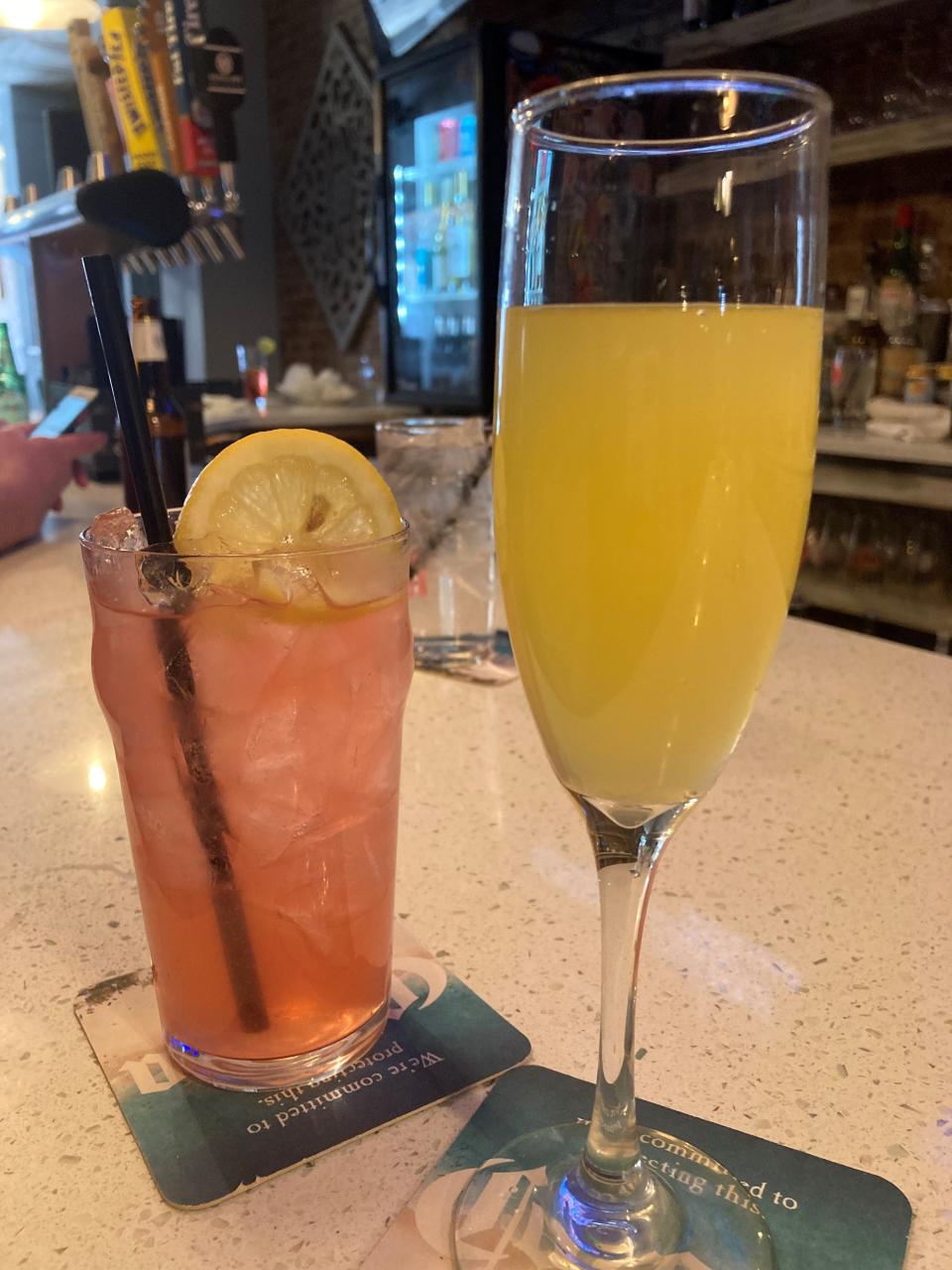 Cocktails at The Henry in Nyack: the Pink Lemonade and a mimosa. Owner Travis Koester would rather people sit and drink at his bar, as opposed to getting cocktails to go. Photographed April 10, 2022.