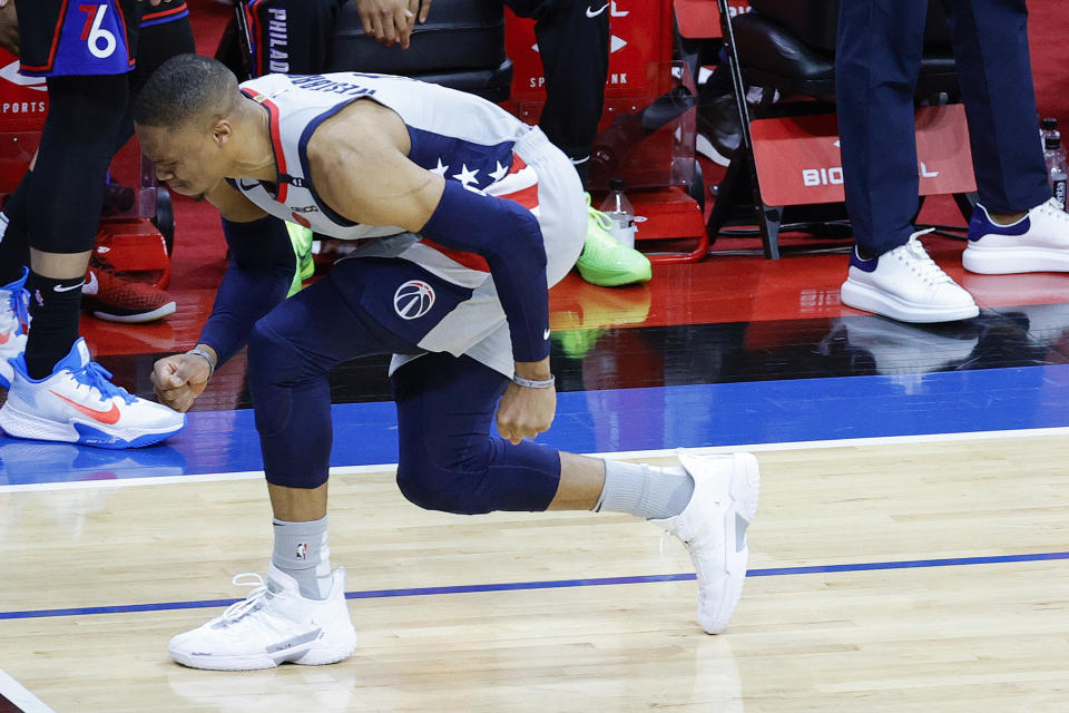 Russell Westbrook #4 of the Washington Wizards winces during the fourth quarter against the Philadelphia 76ers during Game Two of the Eastern Conference first round series at Wells Fargo Center on May 26, 2021 in Philadelphia, Pennsylvania. NOTE TO USER: User expressly acknowledges and agrees that, by downloading and or using this photograph, User is consenting to the terms and conditions of the Getty Images License Agreement.  (Photo by Tim Nwachukwu/Getty Images)