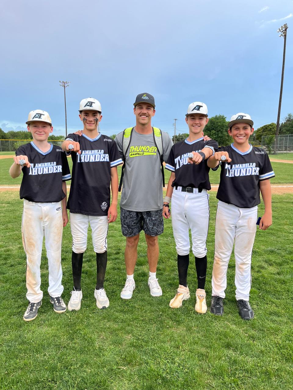 New Borger baseball coach Derek Odell (center) with a group of players.