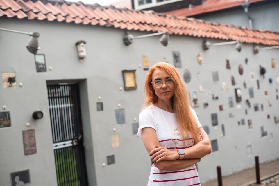 Jurate Pazikaite stands in front of a building