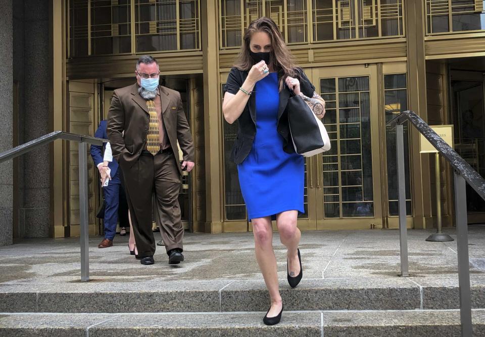 Natalie Mayflower Sours Edwards, right, leaves court after receiving a six-month prison sentence for leaking confidential financial reports to a journalist at Buzzfeed, Thursday June 3, 2021, in New York. (AP Photo/Larry Neumeister)