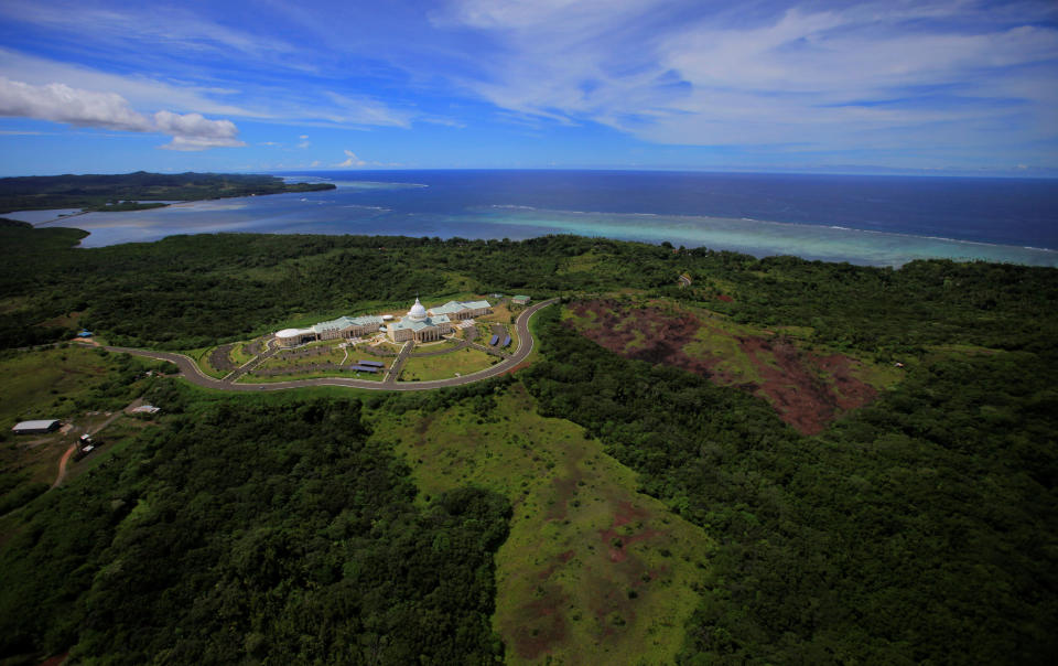 FILE - In this June 20, 2009 file photo, the Palau Capital building is seen in Melekeok, Palau. Defense Secretary Mark Esper plans to fly nearly halfway around the world this week to tiny Palau, which no Pentagon chief has ever visited. (AP Photo/Itsuo Inouye, File)