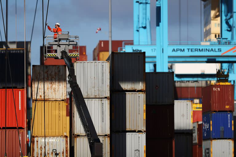 ROTTERDAM, NETHERLANDS - OCTOBER 27:  A general view of workers in the yard working on shipping containers and the cranes which move them at the Port of Rotterdam on October 27, 2017 in Rotterdam, Netherlands. The Port of Rotterdam is the largest port in Europe covering 105 square kilometres or 41 sqaure miles and stretches over a distance of 40 kilometres or 25 miles. Its one of the busiest ports in the world handling thousands of cargo containers on a daily basis. (Photo by Dean Mouhtaropoulos/Getty Images)