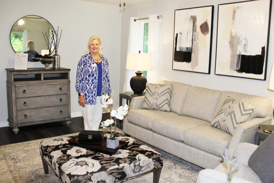 Judy Gooch, interior designer, volunteered her services to stage the new home at 106 Waddell Place, with furniture from Bill Cox Furniture and accessories from Oak Ridge stores. She staged the living room, shown here, and the three bedrooms, bath, kitchen and dining area.