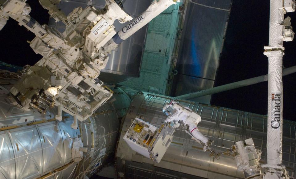 NASA image captured July 12, 2011 - With his feet secured on a restraint on the space station remote manipulator system's robotic arm or Canadarm2, NASA astronaut Mike Fossum (frame center) holds the Robotics Refueling Mission payload, which was the focus of one of the primary chores accomplished on a six and a half hour spacewalk on July 12. The failed pump module is with DEXTRE on left side of the photo. NASA astronauts Fossum and Ron Garan performed the six-hour, 31-minute spacewalk, which represents the final scheduled extravehicular activity during shuttle missions.   Among Atlantis’s final contributions to the ISS is the Robotic Refueling Mission, developed at Goddard Space Flight Center. Atlantis brought this module to the International Space Station, where it will provide key support in maintaining future spacecrafts for years to come. STS-135 astronauts traveled to Goddard to complete special training for these robotics, a major component of the final shuttle mission. RRM is one of dozens of Goddard payloads to travel aboard orbiters into space throughout the 30-year flight history of the Shuttle Program. NASA Goddard Space Flight Center enables NASA’s mission through four scientific endeavors: Earth Science, Heliophysics, Solar System Exploration, and Astrophysics. Goddard plays a leading role in NASA’s accomplishments by contributing compelling scientific knowledge to advance the Agency’s mission. 