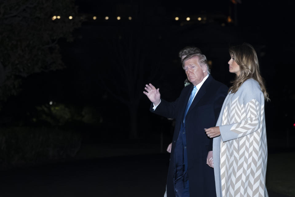 President Donald Trump waves, with first lady Melania Trump and their son Barron Trump, 13, as they walk on the South Lawn after stepping off Marine One at the White House, Sunday, Jan. 5, 2020, in Washington. Trump is returning from a trip to Mar-a-Lago, in Palm Beach, Fla. (AP Photo/Alex Brandon)