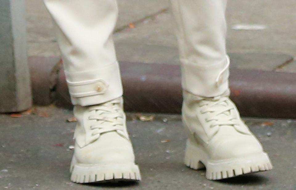 A closer look at Pugh wearing Free Lance Paris Lucy lace-up boots featuring a slightly flared rubber sole in a cream color. - Credit: Splash News