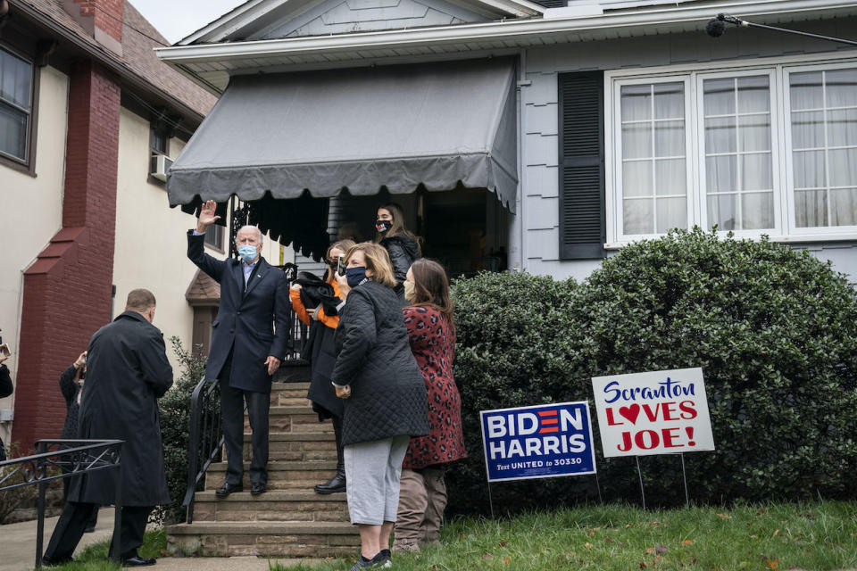 Joe Biden waves from the steps of his childhood home on Nov. 3 in Scranton, Pennsylvania. (Photo by Drew Angerer/Getty Images)