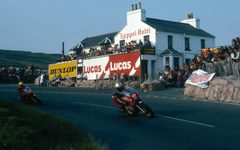 British racing motorcyclist Mike Hailwood (1940 - 1981) leading Joey Dunlop down Mountain Road in the Formula One race at the Isle of Man TT races, June 1978. Hailwood later won the race with Dunlop failing to finish. (Photo by Don Morley/Getty Images) - Credit: Don Morley/Getty Images Europe