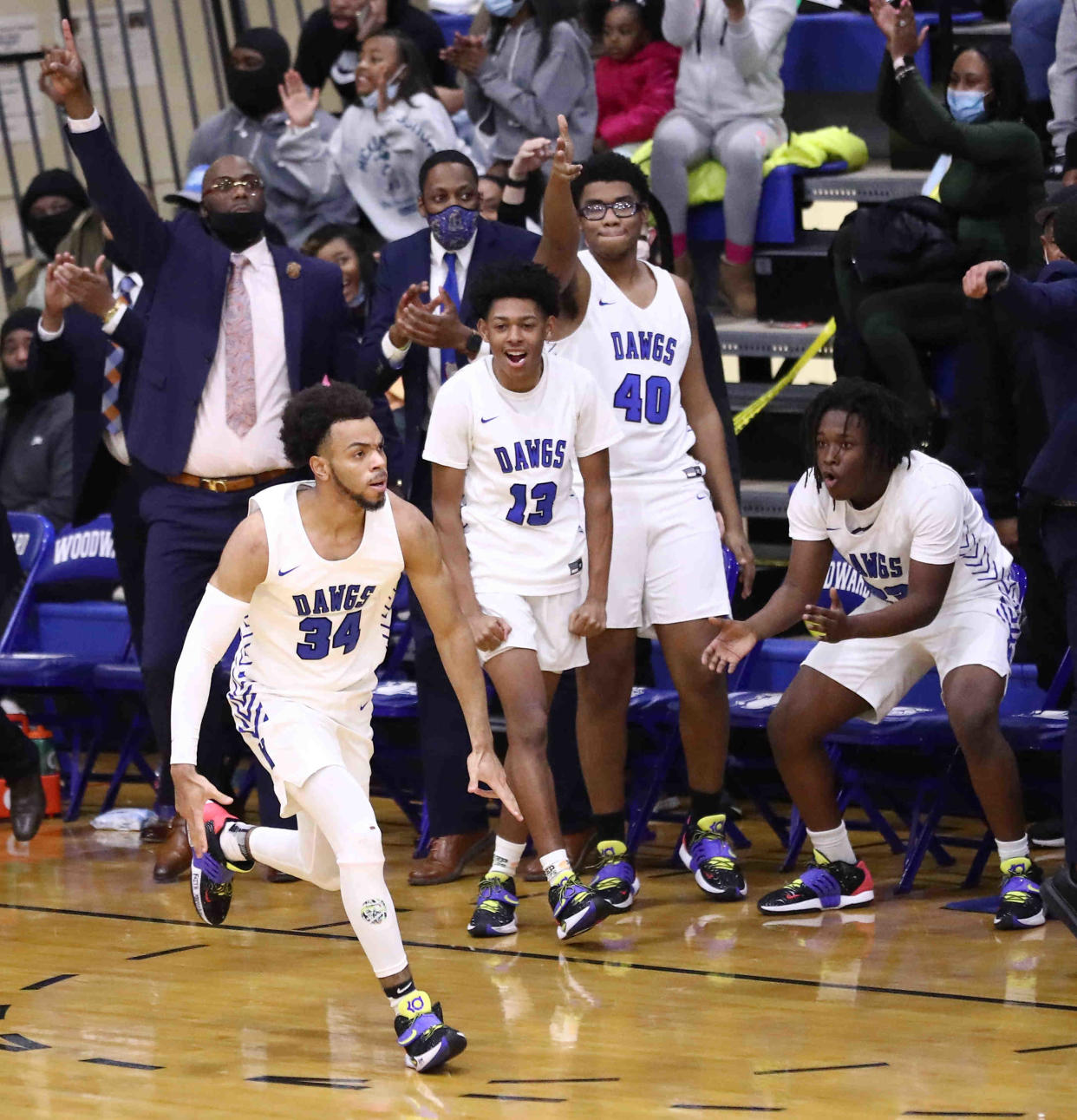 Woodward's Paul McMillan gets encouragement during their basketball game with Taft, Tuesday, Jan. 11, 2022.