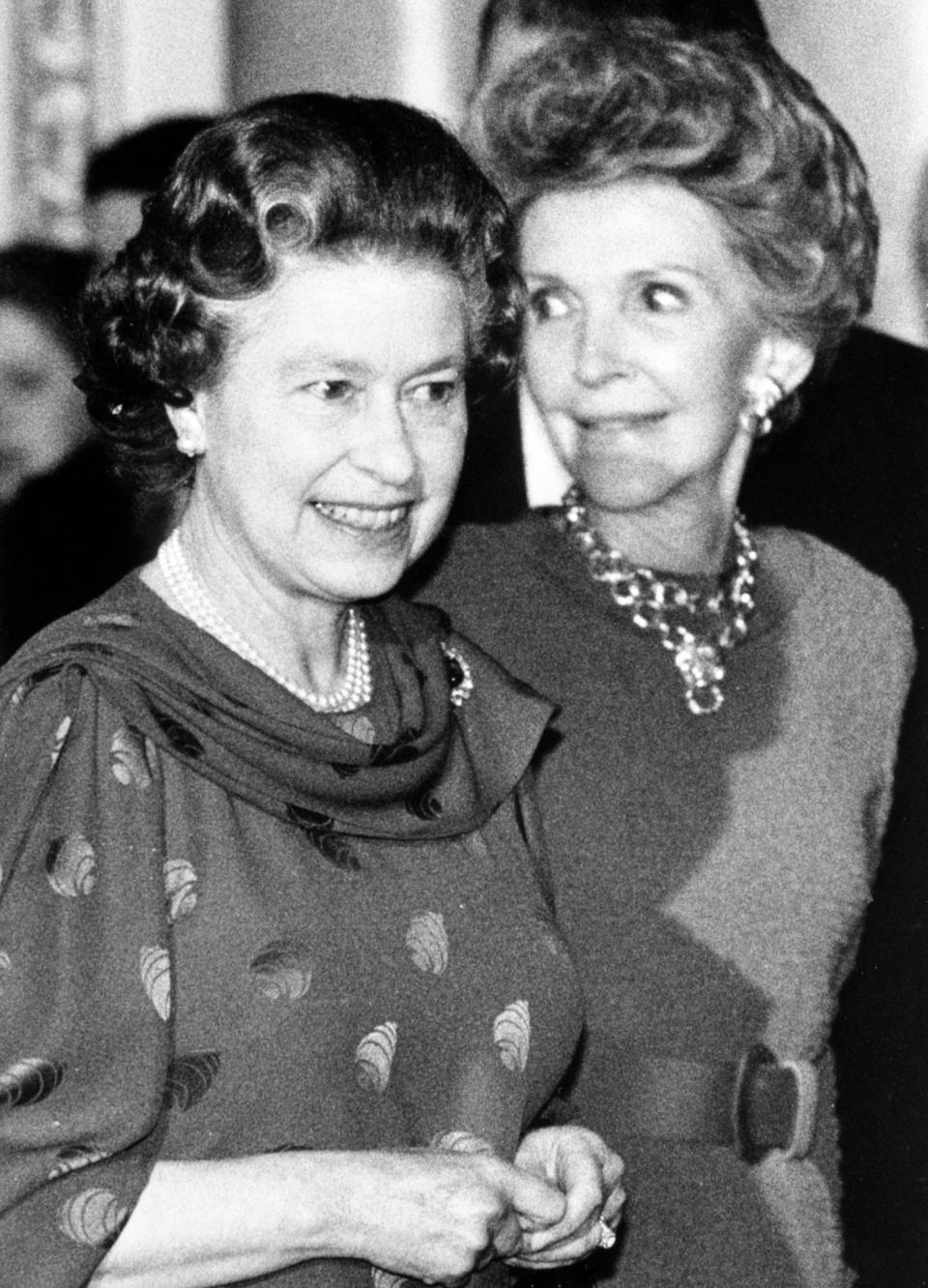 <p>The Queen welcomes the American First Lady Nancy Reagan to Buckingham Palace, where President Reagan and his wife had tea. (PA Archive) </p>