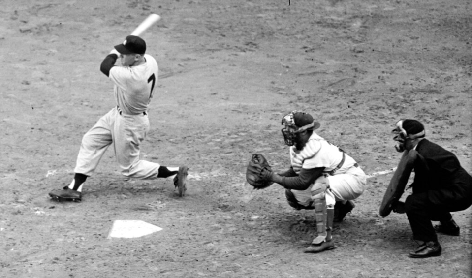 New York Yankees outfielder Mickey Mantle hits a grand slam.