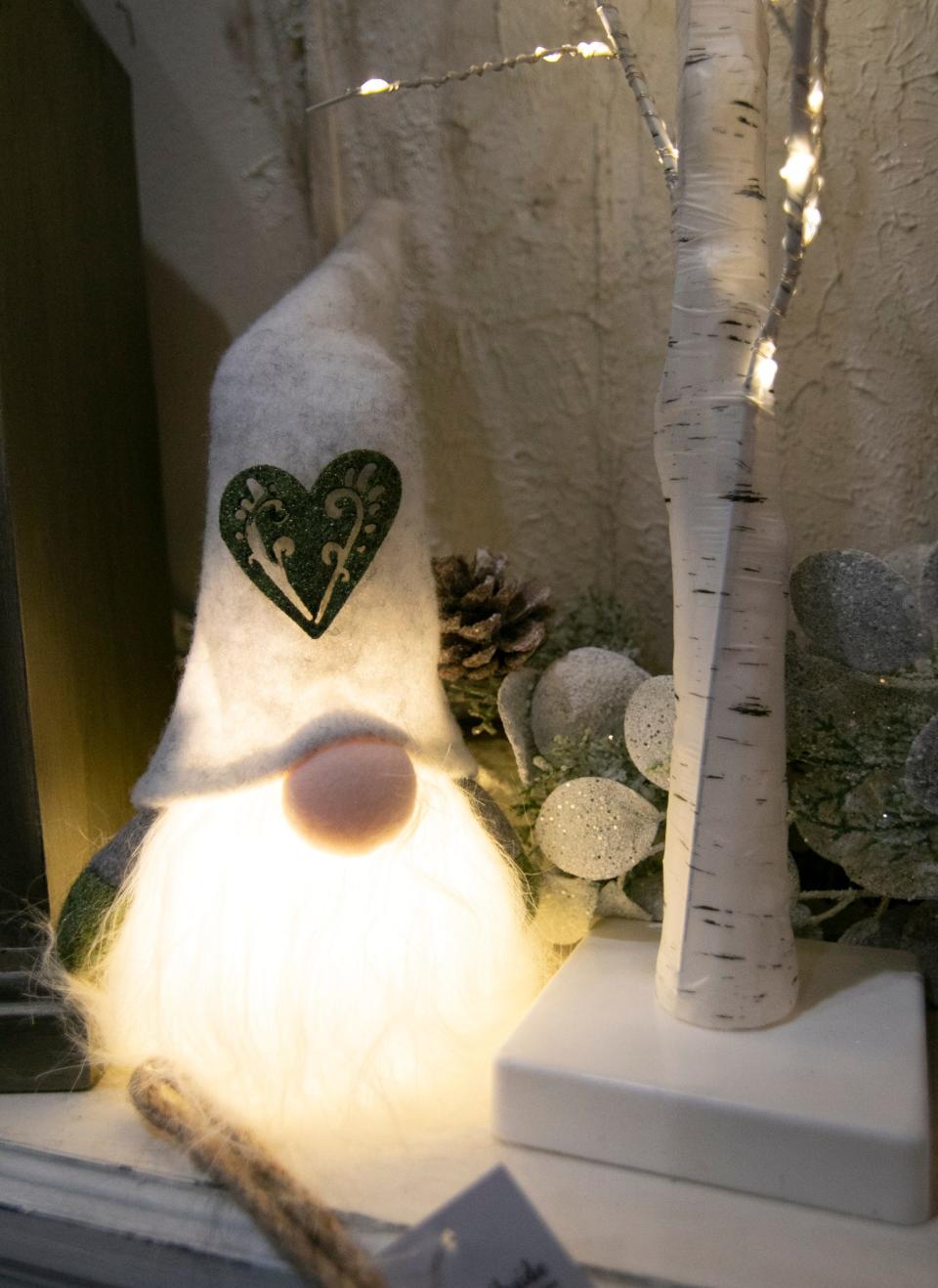 Gnomes are a popular gift found at That's What She Shed Boutique in Hartland Township, shown Tuesday, Nov. 23, 2021.