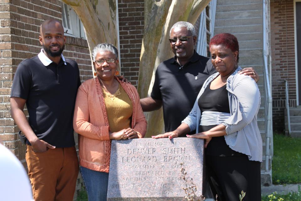 Family members of Denver Smith–(left to right) Denver Terrance, Erma Smith, Nelson Smith and Josephine Smith Jones–visit the memorial to Smith and Leonard Brown at Southern University.