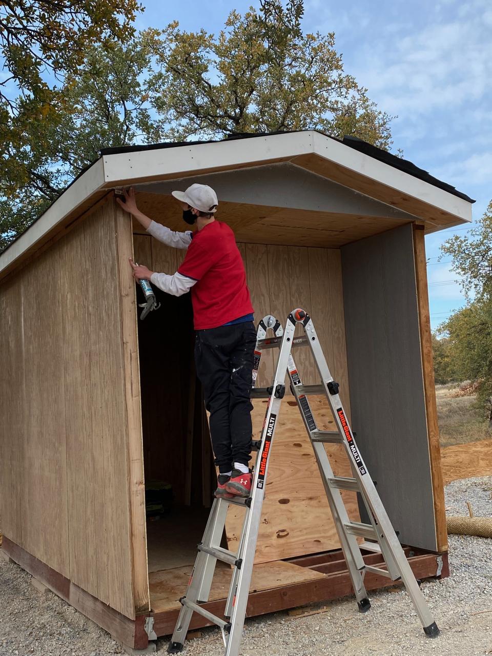 Volunteers, including students from California Heritage YouthBuild Academy, help construct tiny houses at the future Goodwater Crossing community. When completed in 2024, the micro-shelters will house people who are homeless for up to 10 months while they get situated in permanent housing.