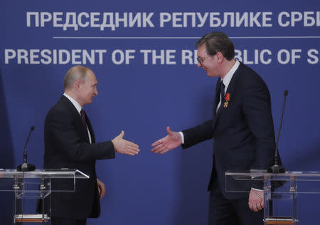 Russian President Vladimir Putin and Serbian President Alexandar Vucic shake hands after the news conference in Belgrade, Serbia January 17, 2019. Maxim Shipenkov/Pool via REUTERS