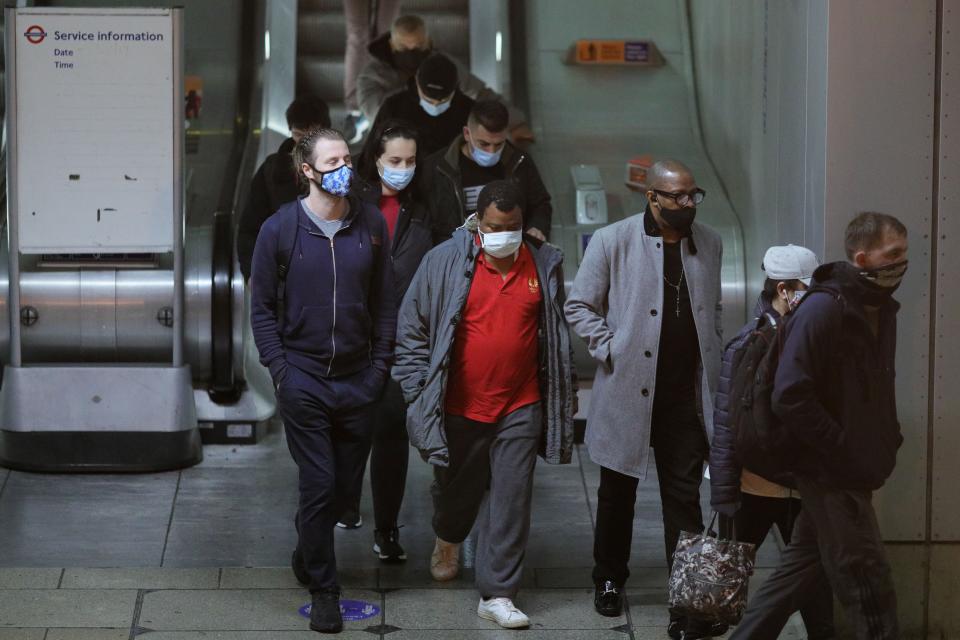 LONDON, Oct. 21, 2020 -- People wearing face masks walk at Canning Town tube and DLR station, in London, Britain, on Oct. 21, 2020. Another 26,688 people in Britain have tested positive for COVID-19, the highest daily increase ever since the pandemic began in the country, according to official figures released Wednesday. (Photo by Tim Ireland/Xinhua via Getty) (Xinhua/Han Yan/Tim Ireland via Getty Images)