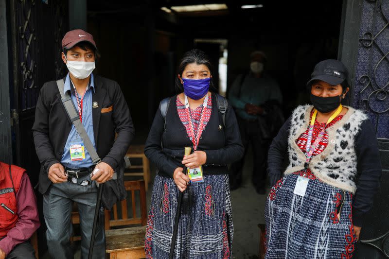 Community members stand at a checkpoint they run at the entrance to the village of Pasajoc amid the outbreak of the coronavirus disease (COVID-19), in Totonicapan