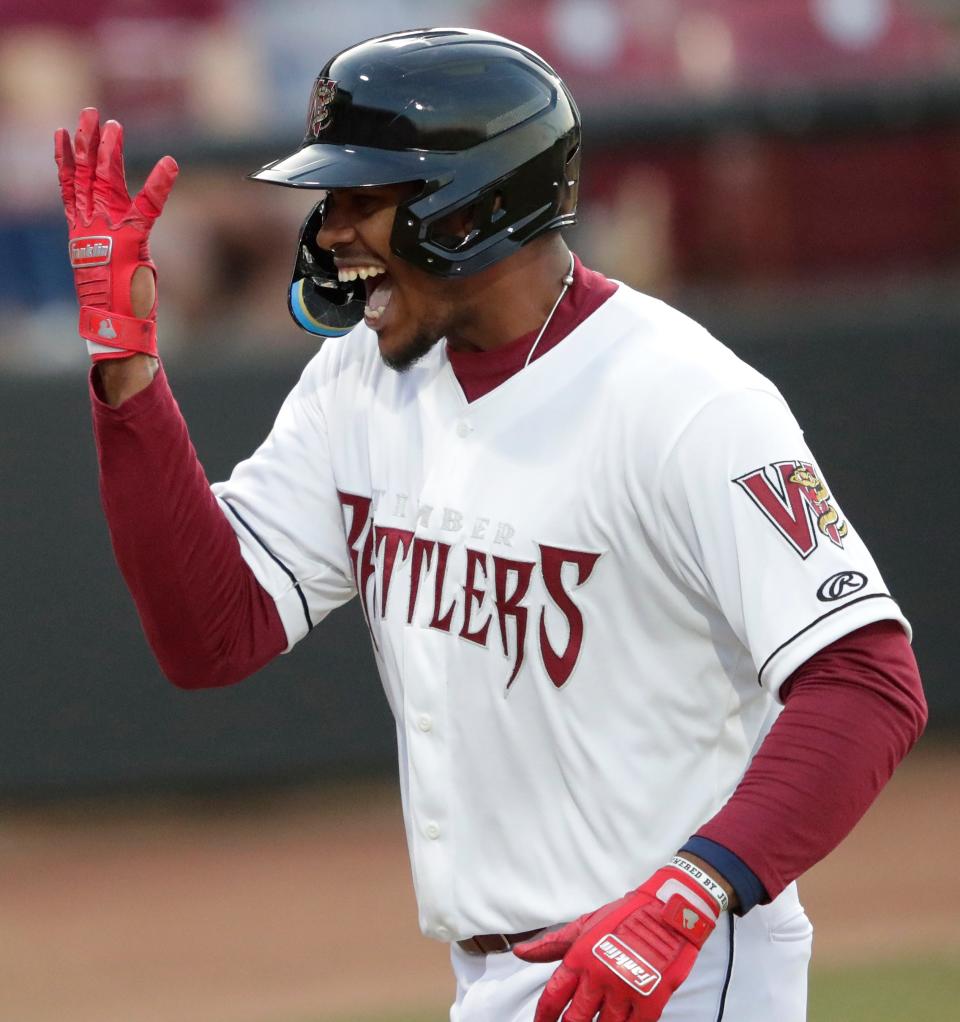 Wisconsin's Ernesto Martinez celebrates after hitting a home run against the Peoria Chiefs during the Timber Rattlers' home opener at Neuroscience Group Field at Fox Cities Stadium in Grand Chute.